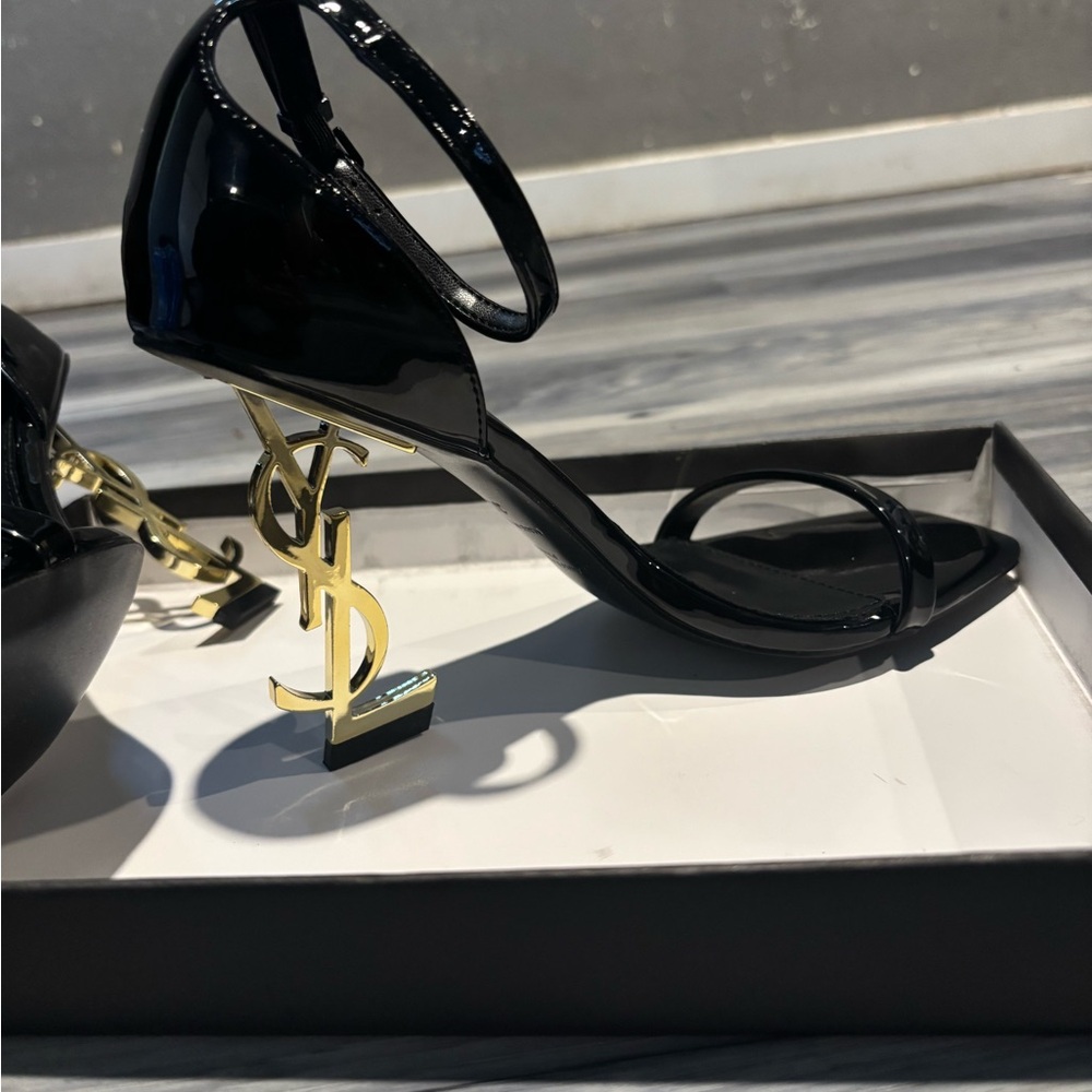 Saint Laurent Glossy Black Heels with Gold Monogram Heel - Picture 2 of 3